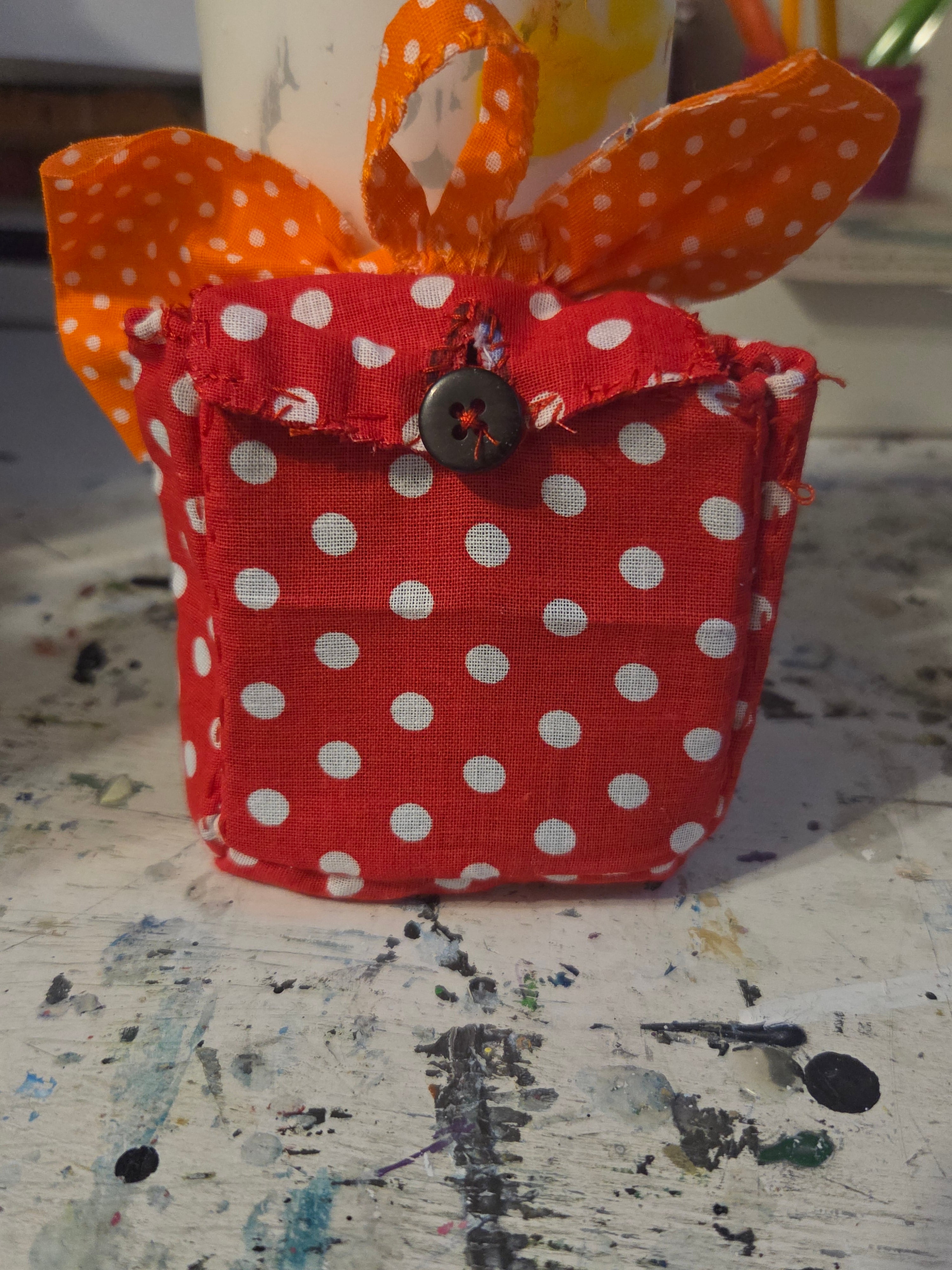Polka dot mini backpack with a big bow.